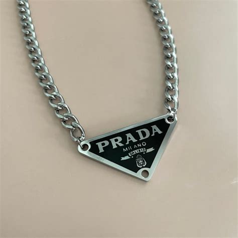 prada triangl|Prada triangle necklace.